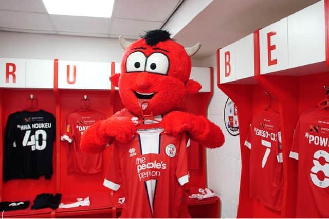 Reggie the Red with one of the shirts to be given away