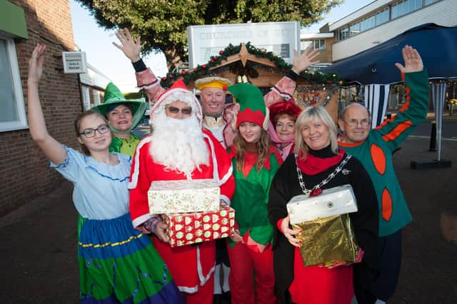 Rustington Christmas event on 3  December 2016. In Photo: Alison Cooper, Chairman of Rustington Parish Council, officially opens the Grotto with the help of Santa, an Elf and some of the cast of the Littlehampton Musical Comedy Society panto Sleeping Beauty. Photo: Scott Ramsey