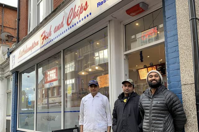 Saty, owner of Littlehampton Fish and Chips, with his staff VJ and Mr Singh outside the restaurant in Beach Road