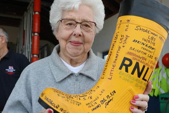 Betty Brooks with the RNLI yellow welly SUS-210312-135933001