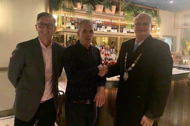 Haywards Heath town mayor Howard Mundin congratulates Rouge's chief operating officer Steve Worrell and general manager Javier Llopis. Picture: Haywards Heath Town Council.
