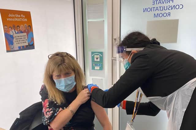 Maria Caulfield MP receiving an injection