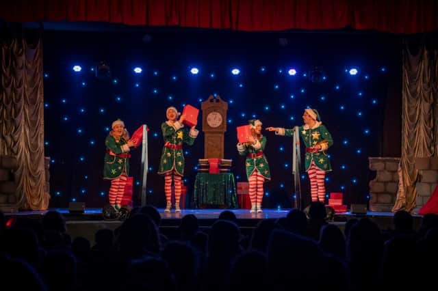 The four cheeky elves on stage in Brighton