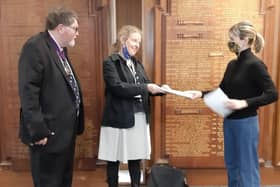 Right, Green district councillor Milly Manley hands a petition to Green county councillor Wendy Maples and county council chairman Peter Pragnell