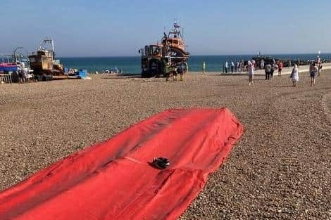 A child's shoes left on a dinghy on Hastings beach. Pic: Simon Hester SUS-210912-094513001
