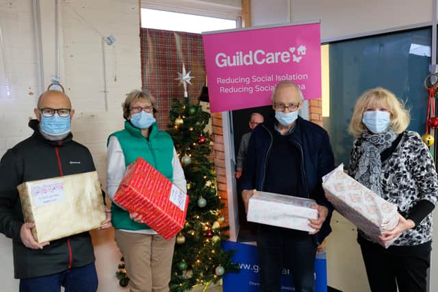 Guild Care’s volunteer co-ordinator, Mark Phillips, and volunteers with Worthing Cares boxes