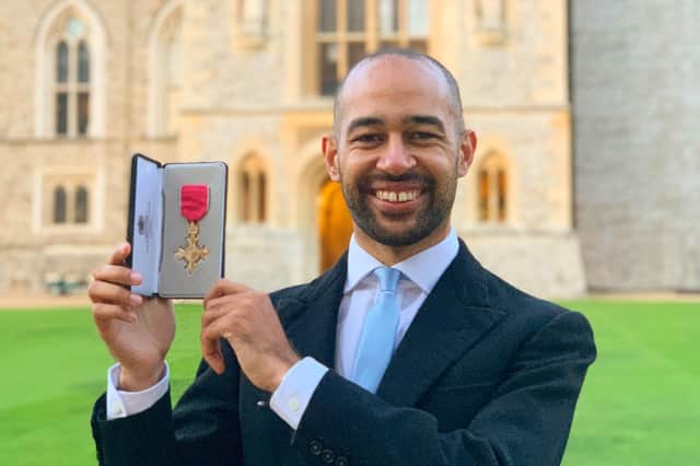 Josh Babarinde with his OBE this week. SUS-210912-140244001