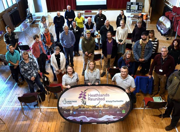 Partners and volunteers at a 2021 event to mark Heathlands Reunited success. (Photo by Anne-Katrin Purkiss) SUS-211213-115431001