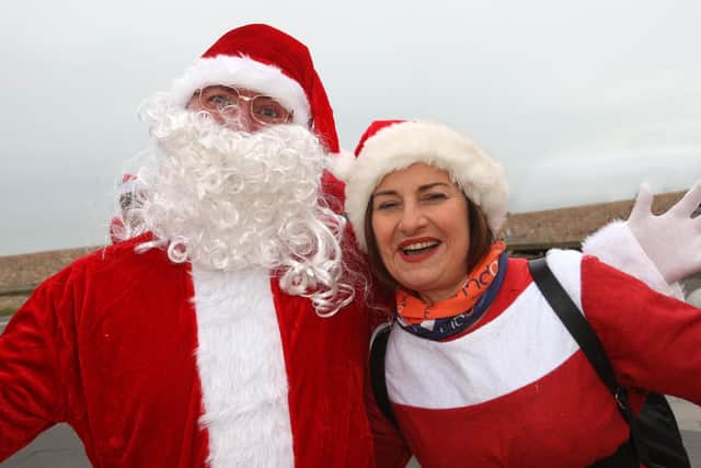 DM21120452a.jpg.  Santas on the Seafront. Organisers, Dean Donaldson and Sue Acaster.  Photo by Derek Martin Photography and Art. SUS-211112-183022008