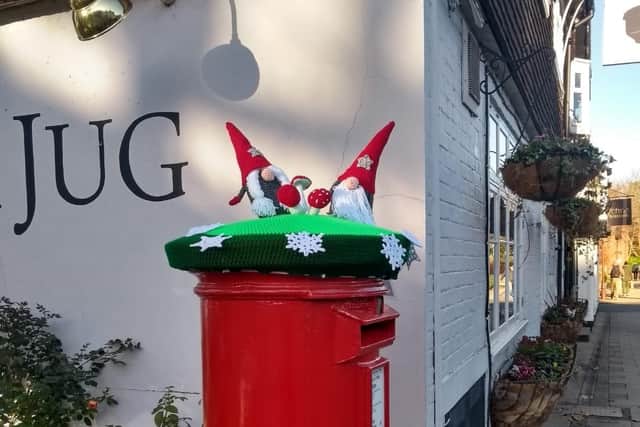 A festive post box topper, created by volunteers at Horsham Normandy WI, has been taken from its location outside the Black Jug
