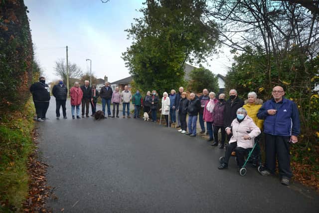 Residents opposing plans to build up to 80 homes in Watermill Lane in Bexhill because Mayo Lane, which is where the the residents are standing, is a very narrow road and will probably get even busier if the plans go ahead. SUS-211215-110813001
