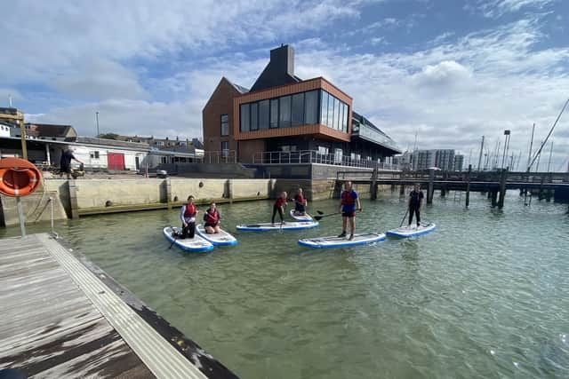 The Stand up Paddleboard (SUP) school at Sussex Yacht Club is holding its annual Santa SUP Event on Sunday. Photo from a previous event