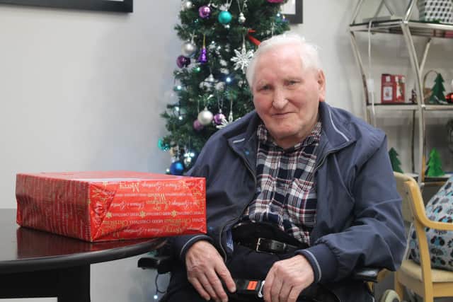 Patrick, a Creating Connections member, with his Worthing Cares box