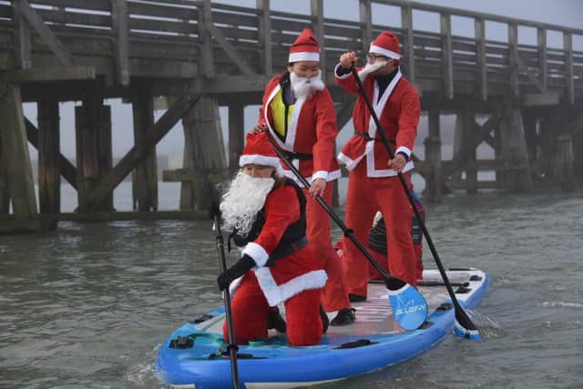 Stand up Santas at the paddleboarding event at Sussex Yacht Club in Shoreham