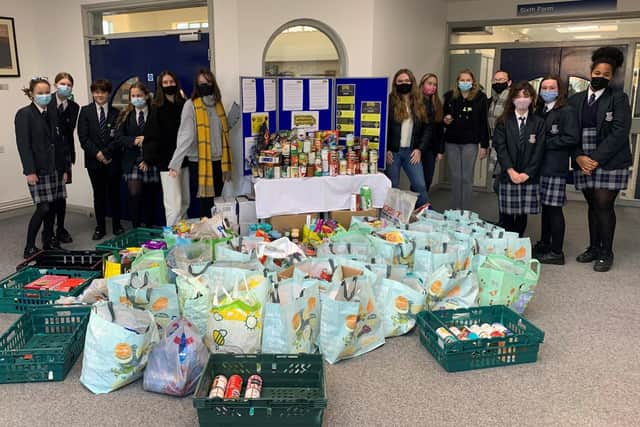 Students with the donations collected for UKHarvest