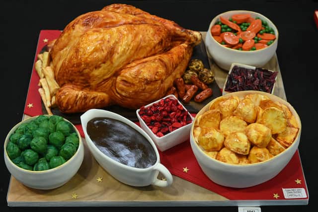 Christmas dinner with all the trimmings is on offer for free from Worthing Soup Kitchen (Photo by OLI SCARFF/AFP via Getty Images)