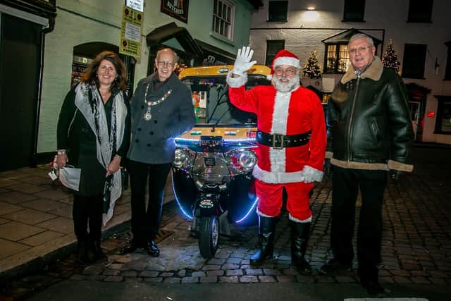 The mayor and Father Christmas were chauffeured by Charles Smiles in his tuk-tuk, which had been specially decorated with Christmas lights for the event.