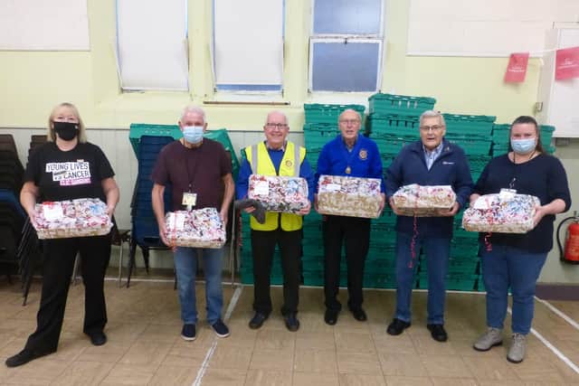 Alison Whitburn, community champion at Morrisons Littlehampton, left, with, from left, Roy Wood, chair of trustees of Littlehampton Foodbank, Rotarians Keith Green, Bruce Green and Geoff Watts, and Nicky Thompson from Littlehampton Foodbank