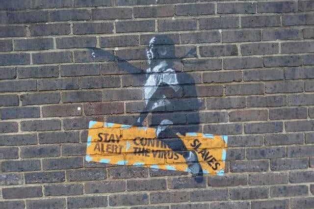 New street art, thought to be a Banksy, appeared on a wall in Crawley in August