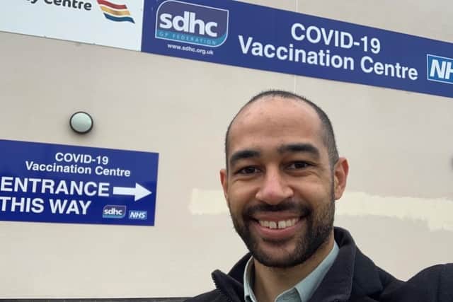 Josh Babarinde outside the vaccine centre in Sovereign Harbour SUS-211222-161614001