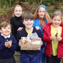 Pupils from St Wilfrid’s Catholic Primary School in Angmering with the spring flower bulbs they were given by David Wilson Homes to plant in the school grounds