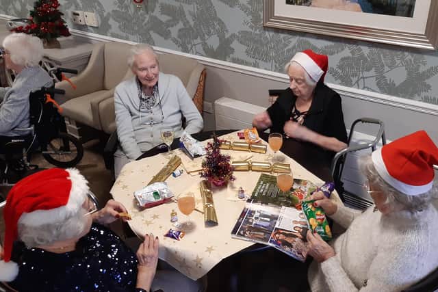 There was wine and fruit punch for residents at the Linfield House Christmas party