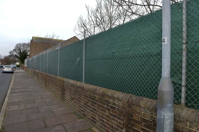 At St Andrews School in Winchelsea Road a tarpaulin has been put up along the length of its playground to protect children from paedophiles (Photo by Jon Rigby) SUS-211223-102619008