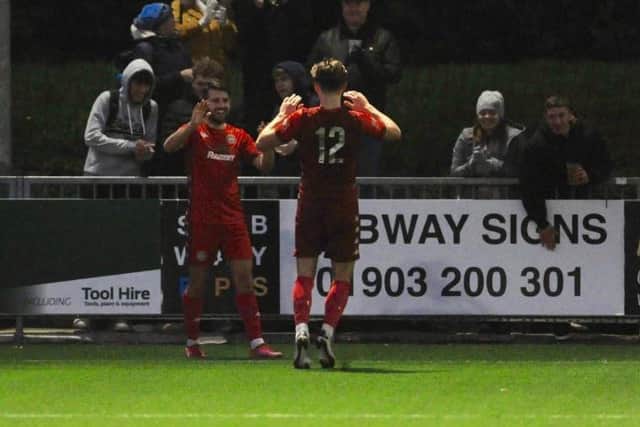 Pearce is congratulated after netting his second of the afternoon