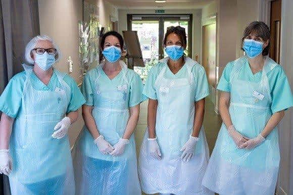 St Wilfrids Hospice Eastbourne nurses In PPE. Ruth Bacon, Freya Springall, Nyree Vine and Maria De Torie SUS-211223-171008001