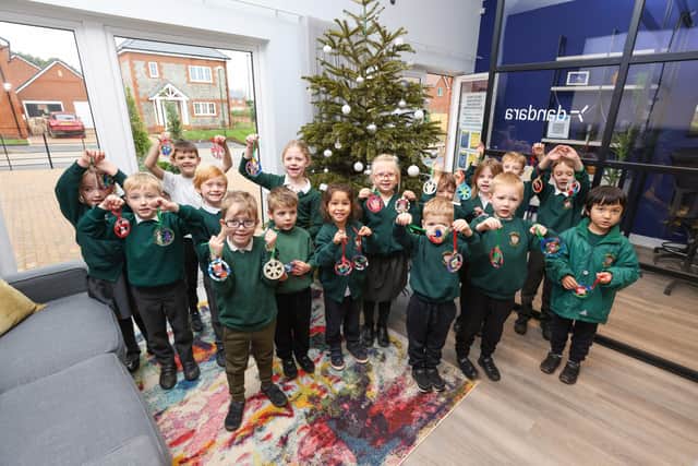 Yapton CofE Primary School with their hand decorated wooden baubles for the Paddock View Christmas tree