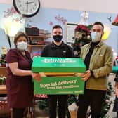 Jamie and James from Dunelm donating Christmas gifts to Elmcroft residents