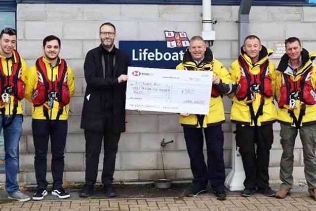 The cheque being presented to the RNLI Eastbourne volunteers by Daniel King of Urban Industry. Picture from Eastbourne RNLI SUS-211224-121645001