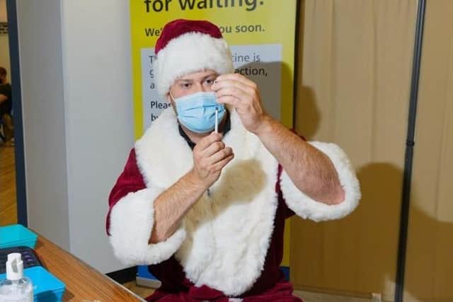'Santa' has been taking time out to distribute Covid vaccines
