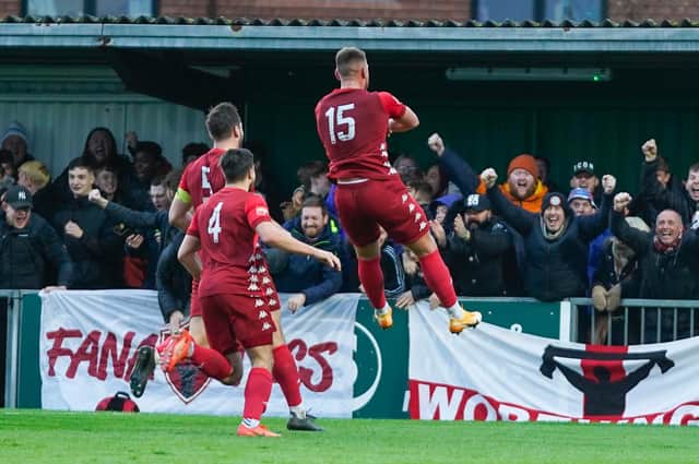 Callum Kealy leaps to celebrate his equaliser at Bognor to the delight of the Worthing fans / Picture: Trevor Staff
