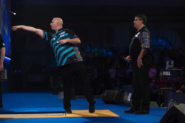 Rob Cross goes for glory versus Gary Anderson / Picture: Lawrence Lustig - PDC