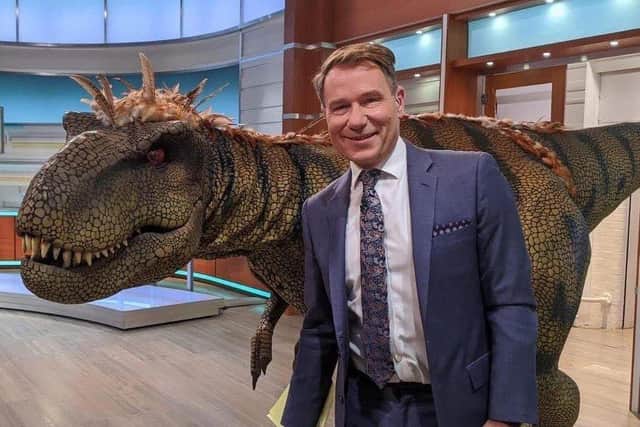 One of Dinomania's dinosaurs with TV presenter Richard Arnold