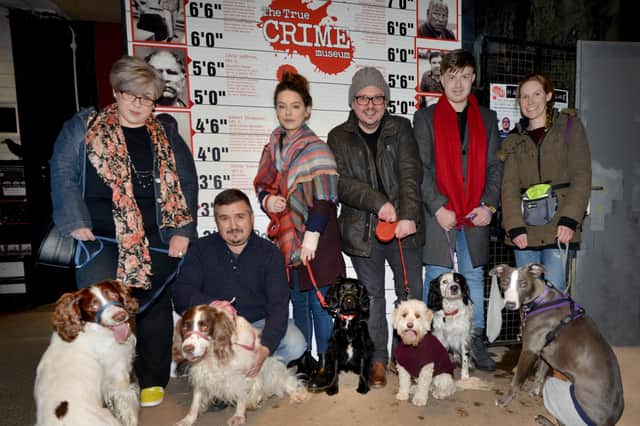 Photo was taken at 2018's Dress Up Your Dog Day at The True Crime Museum in Hastings.

Curator Joel Griggs (centre) with a few of the visitors. SUS-220901-104830001