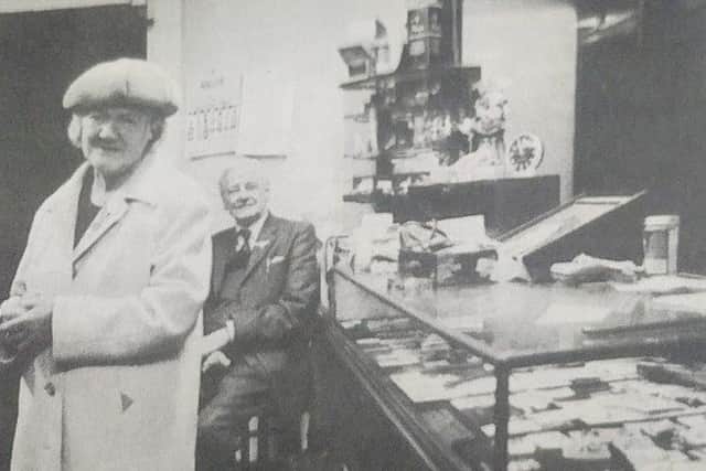 Charles 'Ronnie' Allen and his sister Mary 'Maisie' Allen in their jewellery shop, where neon lighting was one of their few concessions to modernity