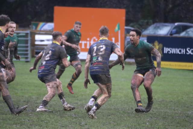 Worthing Raiders and Bury do battle in the mud / Picture: Colin Coulson