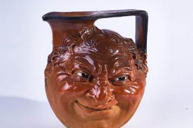 A large Martin Brothers stoneware face jug is one of the items up for sale at the auction