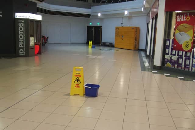Buckets are frequently placed in Horsham's Swan Walk shopping centre to catch rainwater leaking from the roof