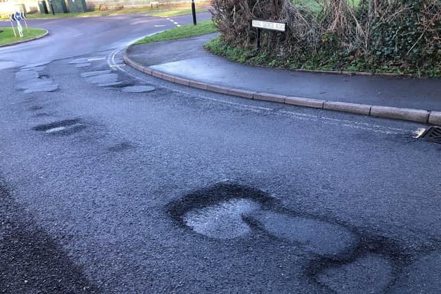 Potholes near the roundabout on Royal George Road, Burgess Hill. Picture: Mustak Miah.