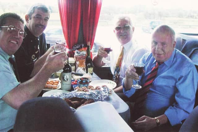 Stan Eavis, in the blue shirt on the right, enjoying a Borough awayday