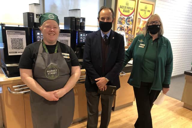 The High Sheriff of West Sussex, Neil Hart, with community champion Alison Whitburn, right, and cafe colleague Gill Paterson