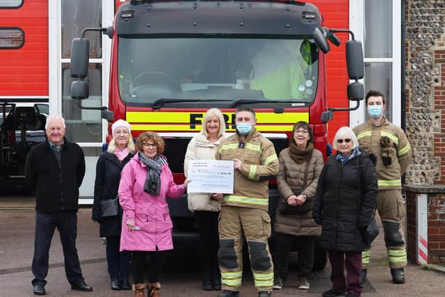 East Preston Yarnbombers presenting a cheque for £1,231 to firefighter Darren Seymour at East Preston Fire Station on Tuesday, January 18, for The Fire Fighters Charity