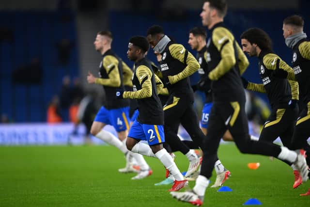BRIGHTON, ENGLAND - JANUARY 18: Tariq Lamptey of Brighton & Hove Albion warms up prior to the Premier League match between Brighton & Hove Albion and Chelsea at American Express Community Stadium on January 18, 2022 in Brighton, England. (Photo by Mike Hewitt/Getty Images) SUS-220118-193411001