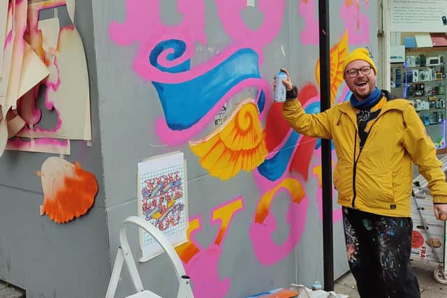 Artist Dave Pop working on the Enliven Brighton Art Trail