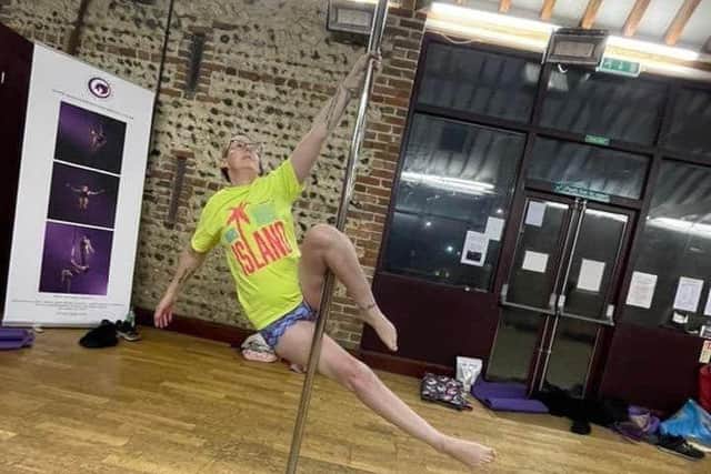 Sarah Michaeloudis demonstrating her skills at a pole dancing class