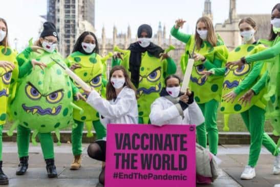 Tara Geoghegan, 22 took part in a stunt with ONE Campaign on Tuesday (January 18), where participants dressed up as COVID-19 viruses and doctors outside Big Ben, the activists were pictured as viruses attacking doctors.