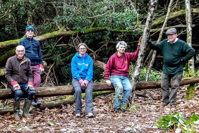 Volunteers from the Sandgate Conservation Society take a break from work at Sandgate Park. Photo: Brian Burns